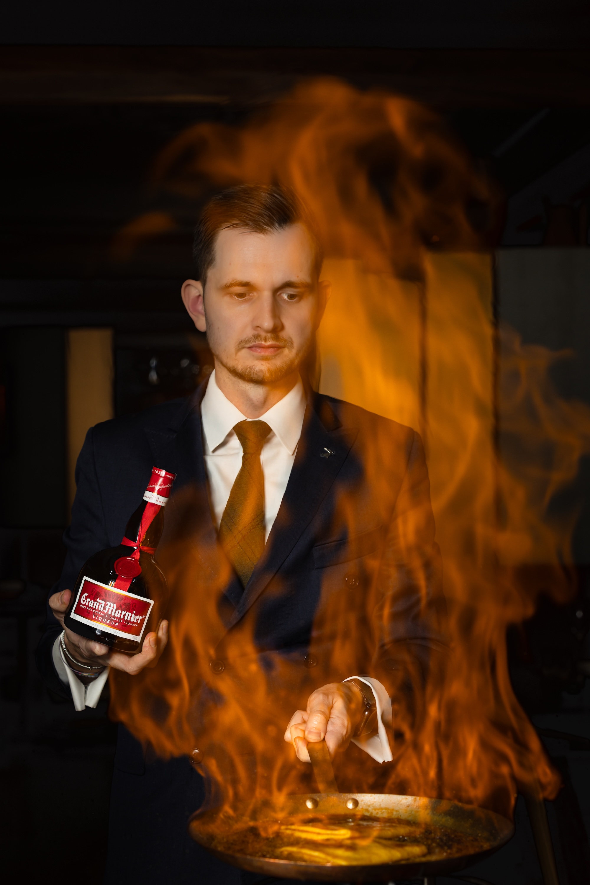 Manager Louis Gillibert setting the crêpes ablaze