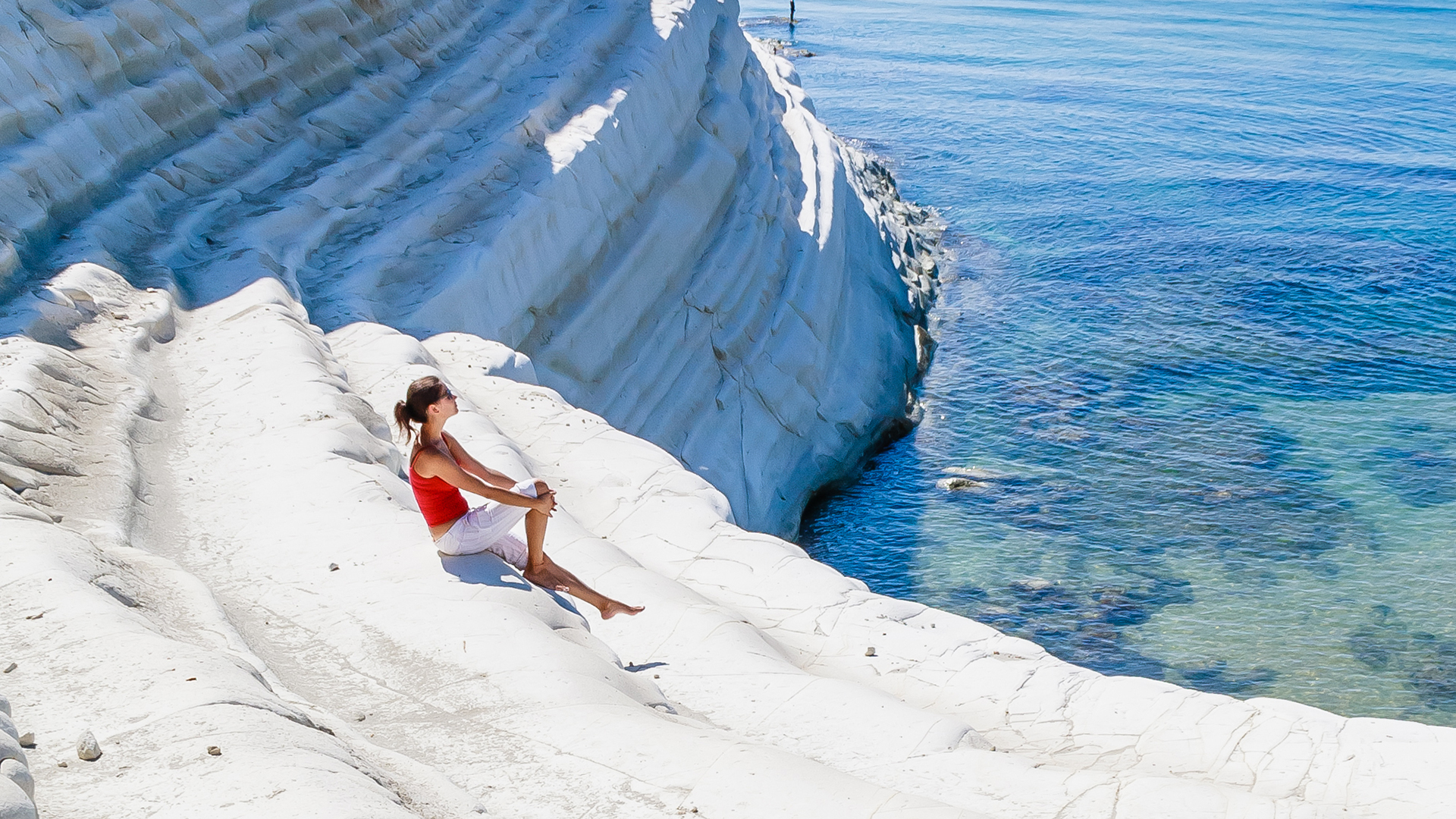 Girl sitting on a rock